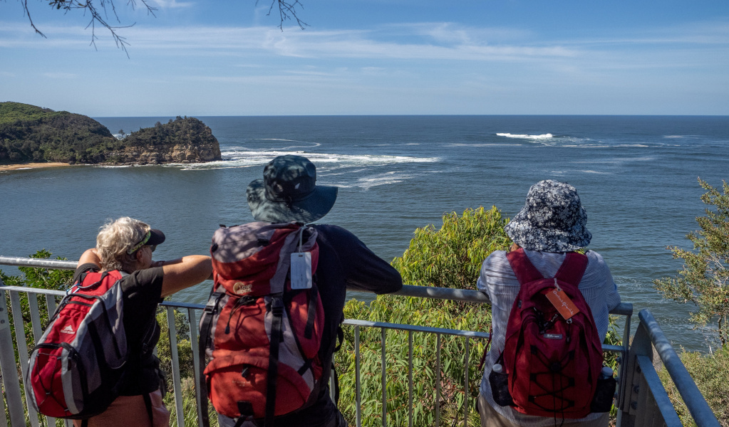 Three people wearing hats looking at ocean view at West Head. Photo &copy; Graeme Clarke