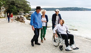 Visitors on the wheelchair accessible path at Shark Beach, Nielsen Park. Photo: Simone Cottrell © DPE