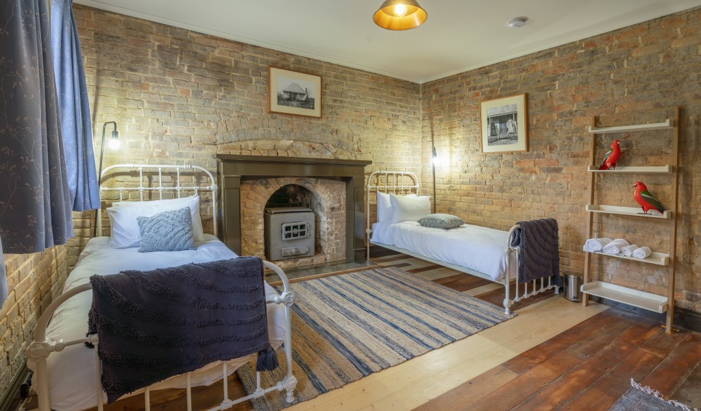 A bedroom with 2 single beds in Fairfax House in Hill End Historic Site. Photo: John Spencer &copy; DPE