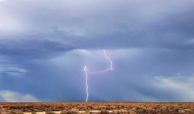 Distant lightening striking the plain near Hay, Kalyarr National Park. Photo: Samantha Ellis © DPIE